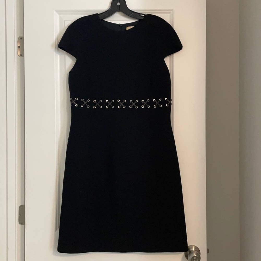 Black wool Michael Kors dress with leather cross stitch detailing at waist.